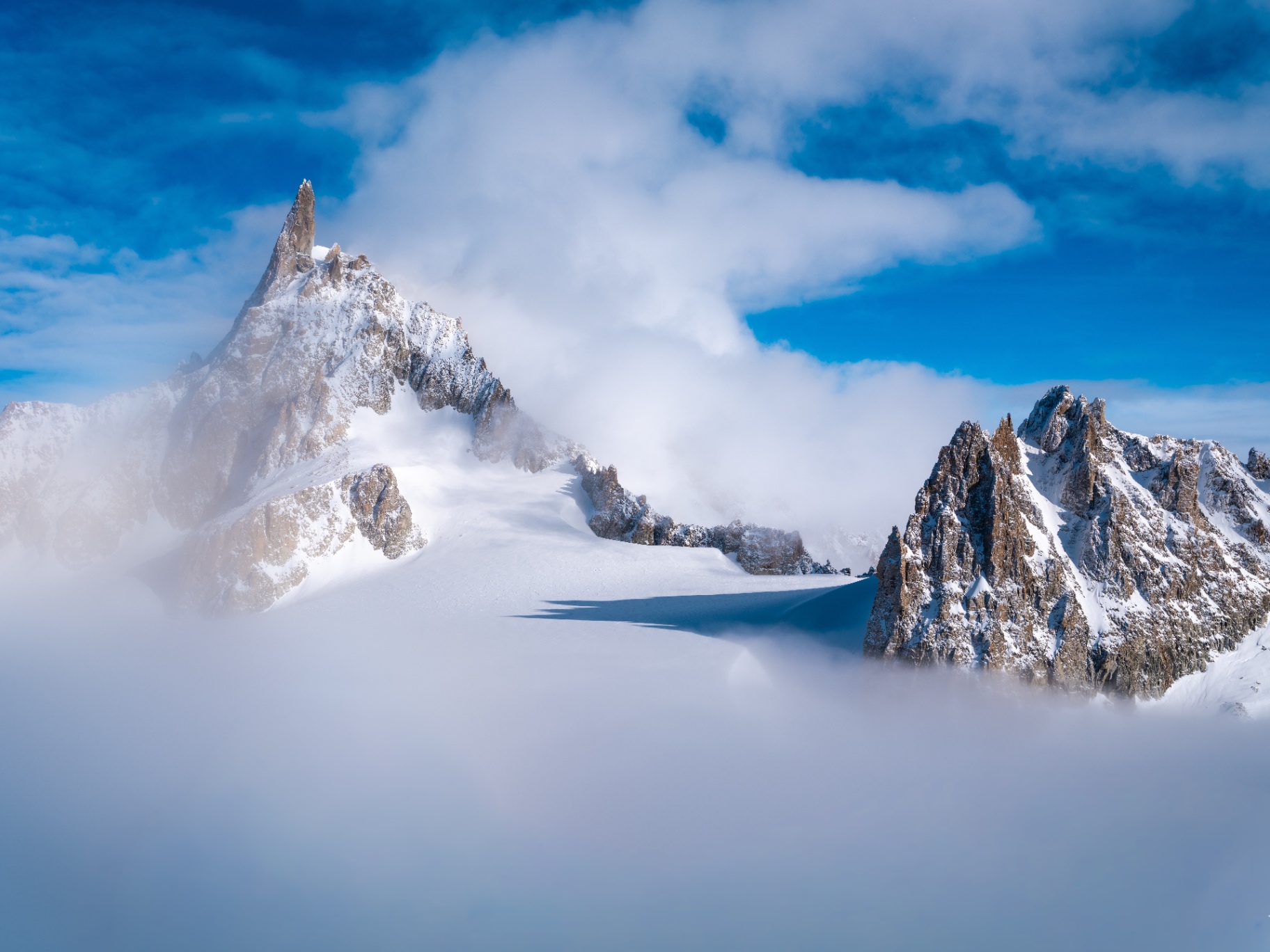 Panorama of the Dent du Géant among the clouds