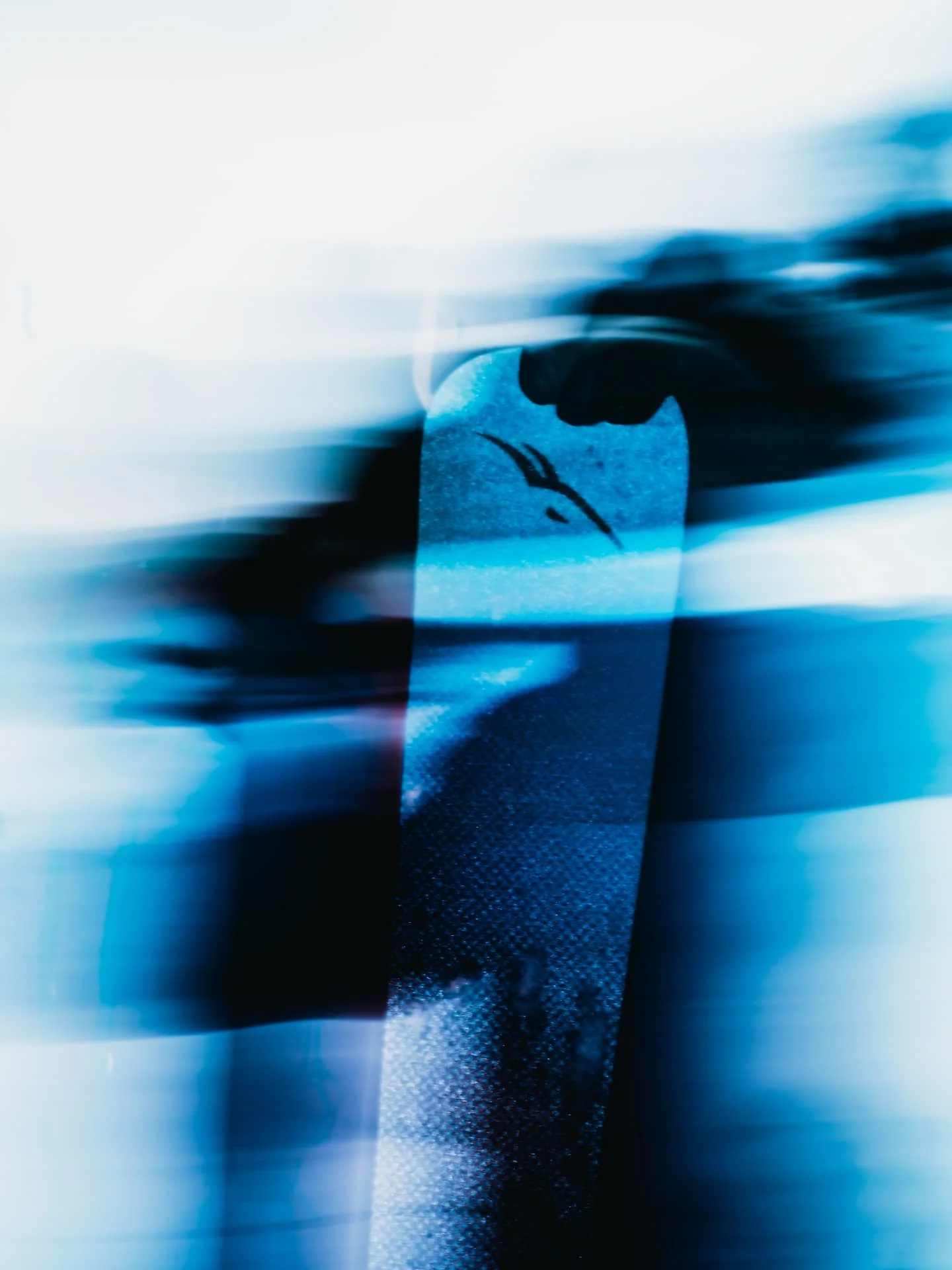 Abstract blue motion study focused on a ski tip