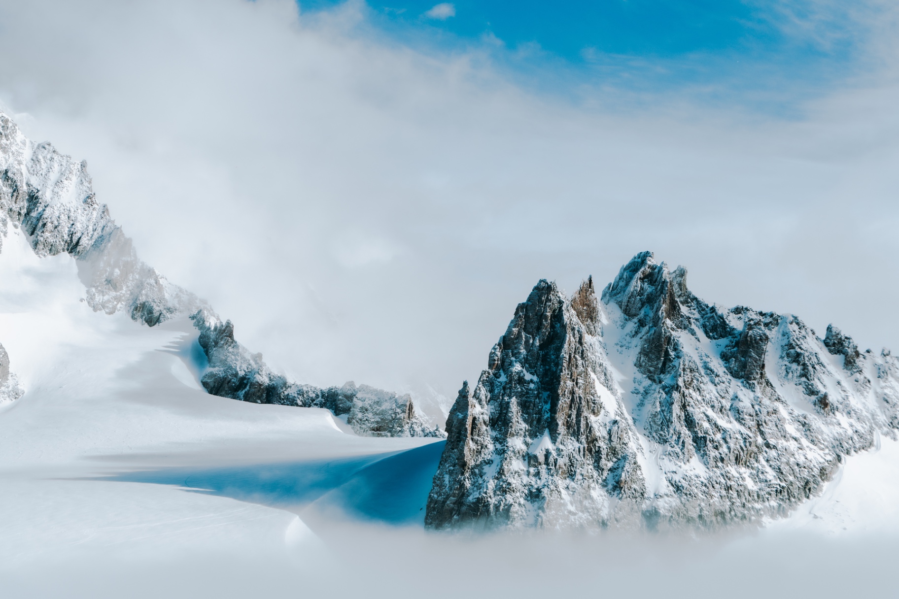 Granite pinnacles emerging from a sea of mist