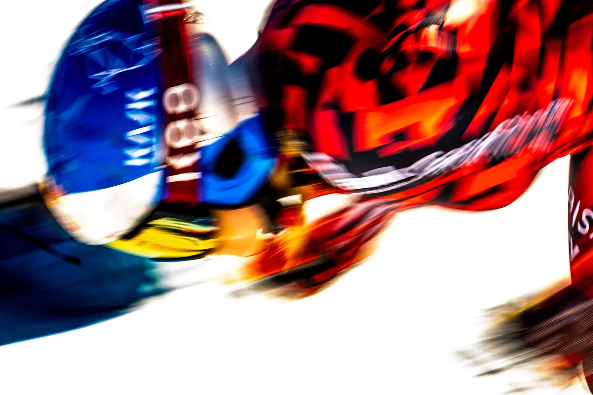 Abstract motion study of a ski racer in red and blue