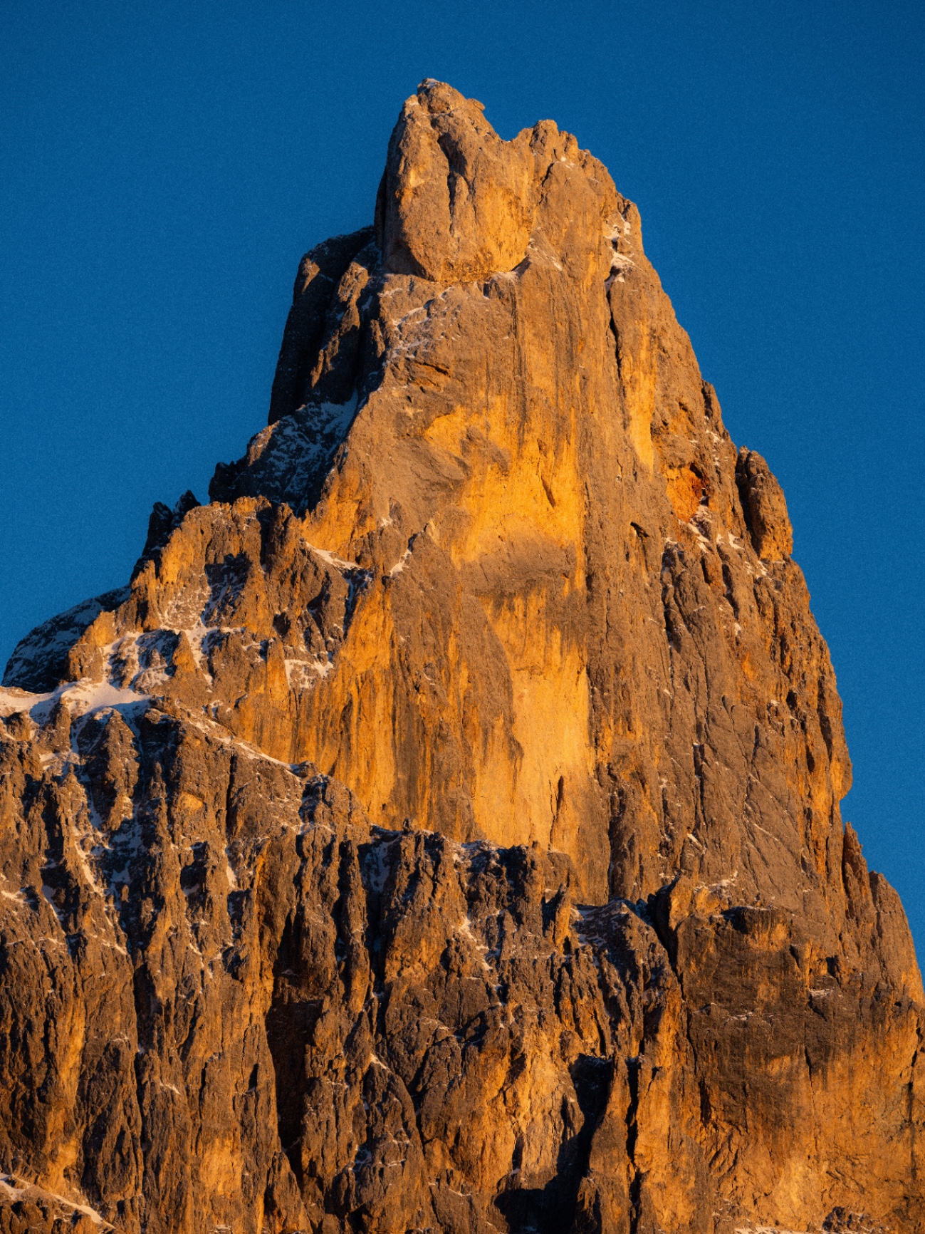 Dolomite spire lit by the sun at sunset