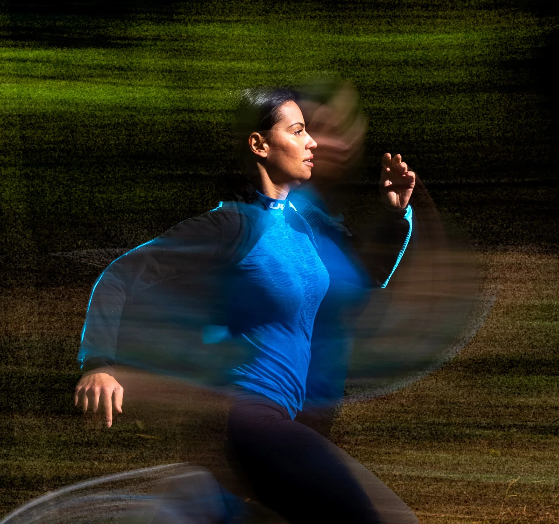 Athlete running through a layered motion study